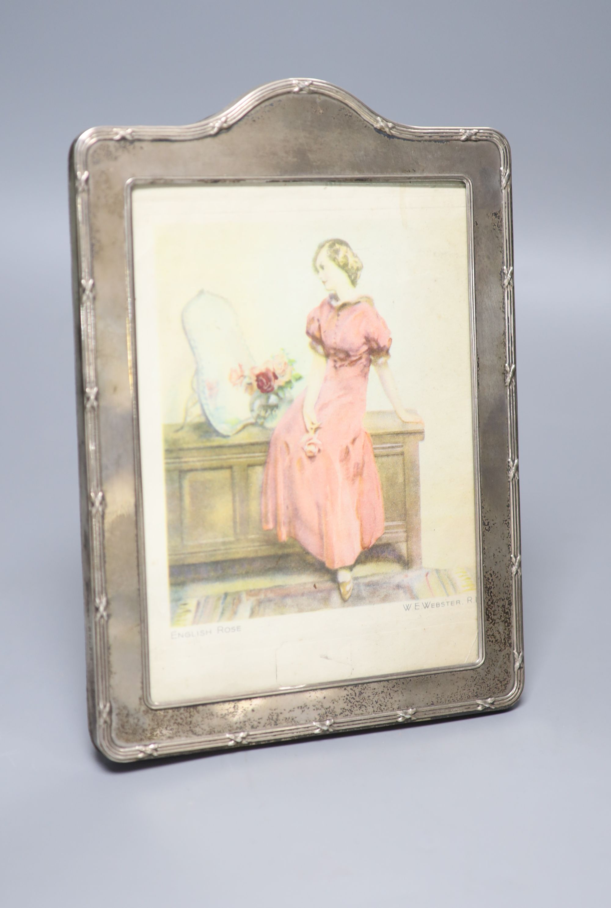 A modern silver mounted photograph frame, with reeded ribbon border, 23.2cm.